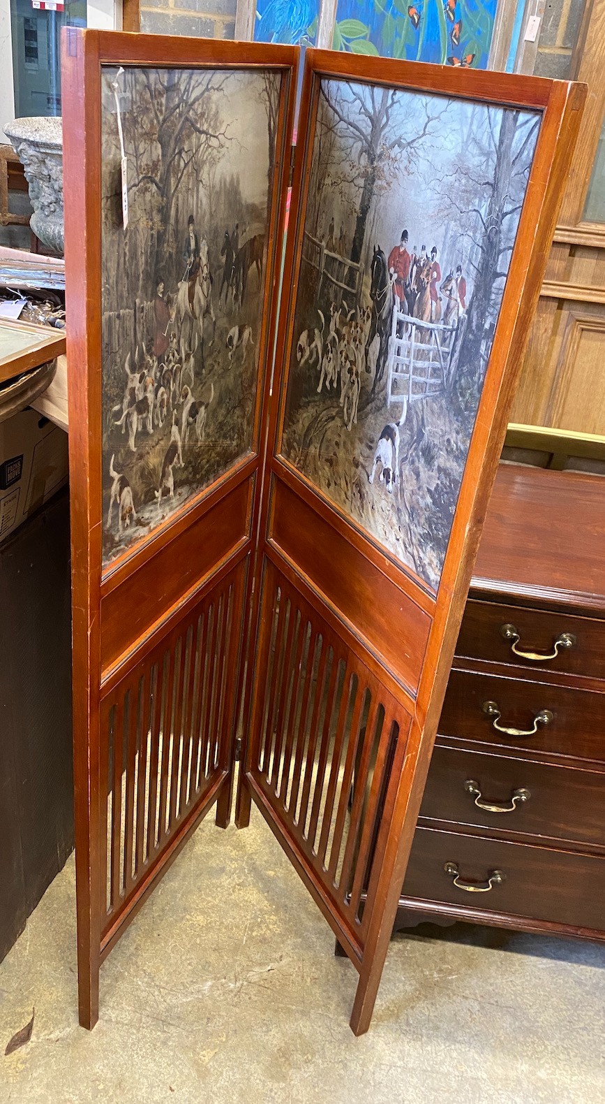 An Edwadian mahogany two fold screen inset with printed hunting scenes, each panel width 54cm, height 156cm